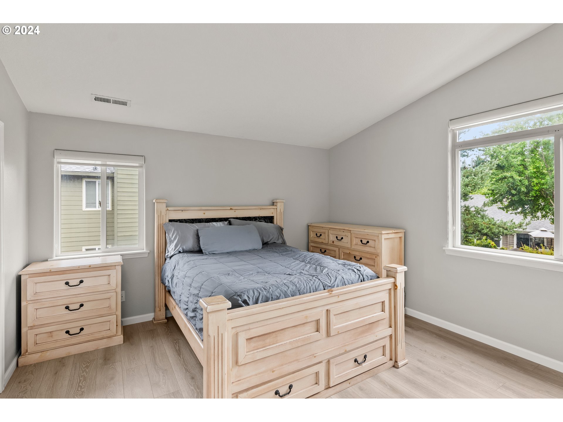 216 Southwest Sutherland Way Beaverton, OR 97006 - Photo 10 of 19 a bedroom with a bed and a dresser