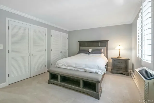 a bedroom with a bed and a table