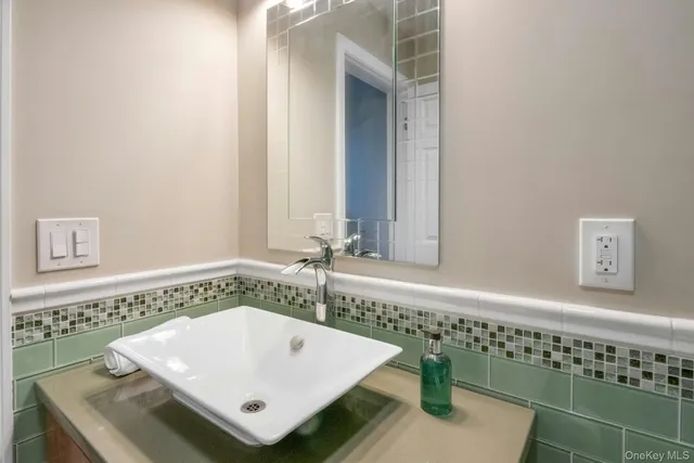 a bathroom with a bathtub and a sink