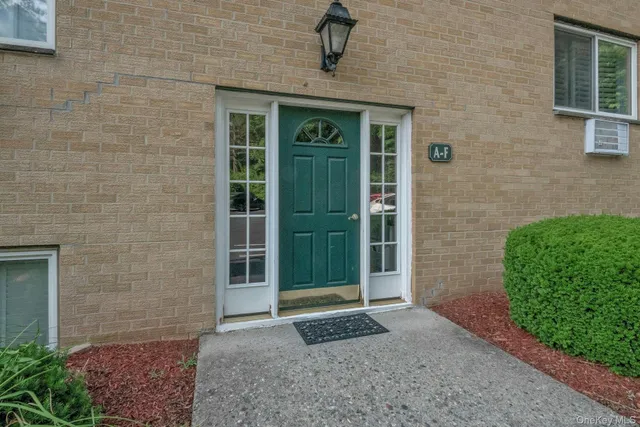 a view of a brick house with a large door