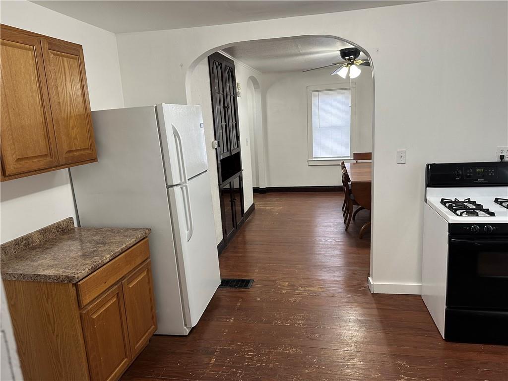 1431 Hooker Road Karns City, PA 16041 - Photo 17 of 18 a kitchen with stainless steel appliances granite countertop a refrigerator a stove and a sink