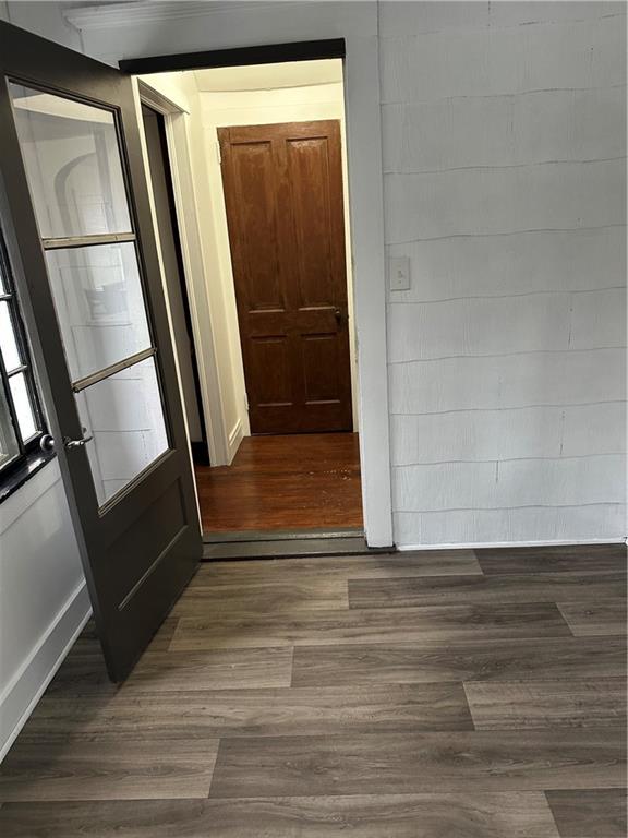 1431 Hooker Road Karns City, PA 16041 - Photo 6 of 18 a view of an empty room with wooden floor and a window