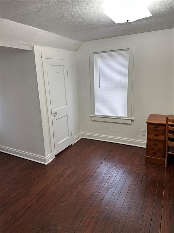1431 Hooker Road Karns City, PA 16041 - Photo 8 of 18 an empty room with wooden floor and windows