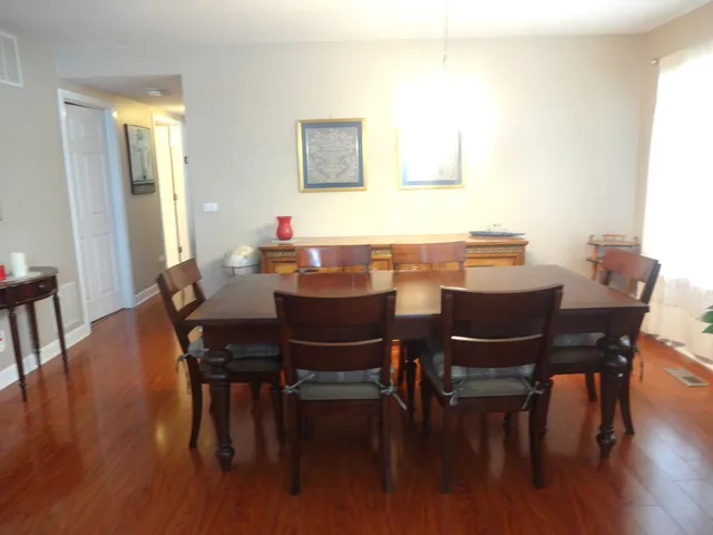 a kitchen with stainless steel appliances a refrigerator and a stove