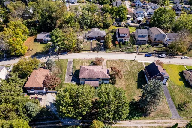 an aerial view of houses with yard