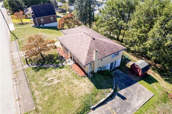 an aerial view of houses with yard