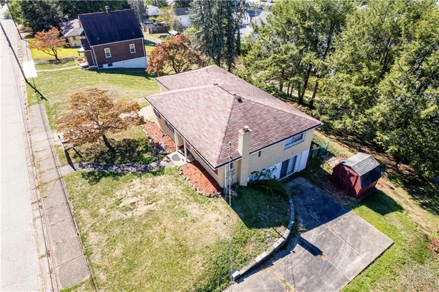 an aerial view of houses with yard
