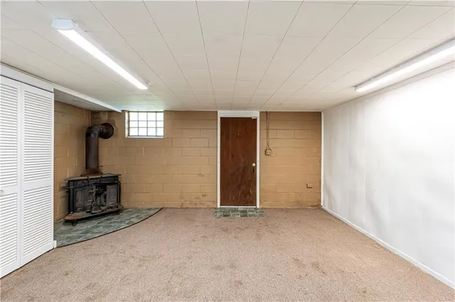 an empty room with furniture and windows