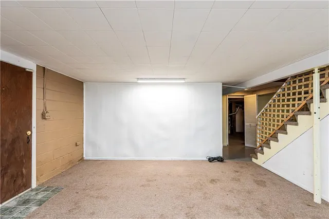 a view of an empty room with stairs