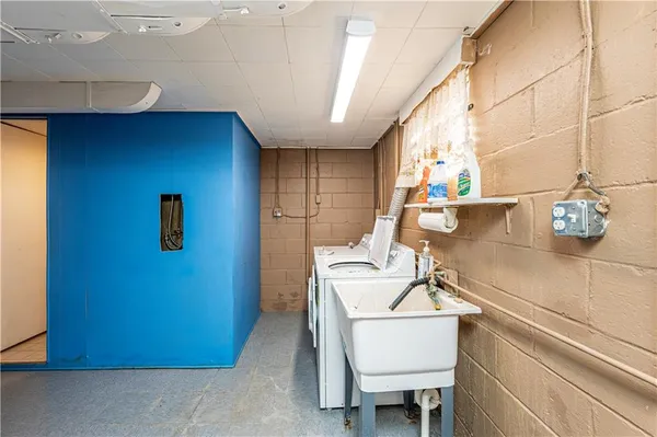 a kitchen with a sink cabinets and window