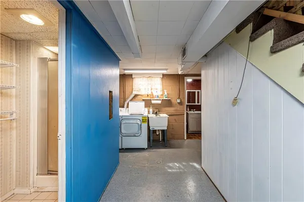 a kitchen with a stove a refrigerator and a table