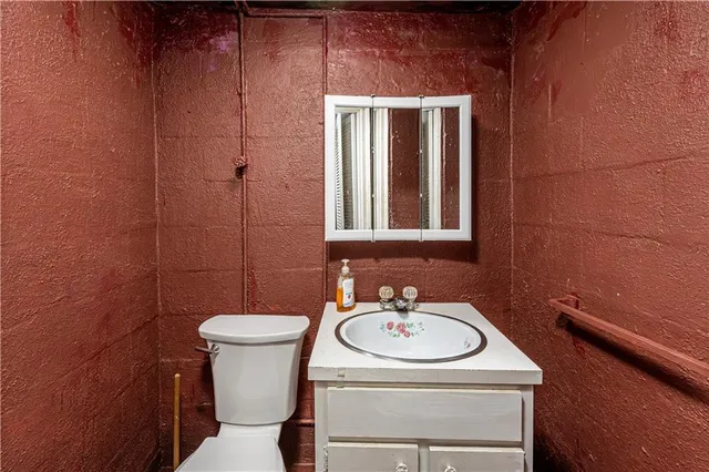 a bathroom with a sink a mirror and a shower