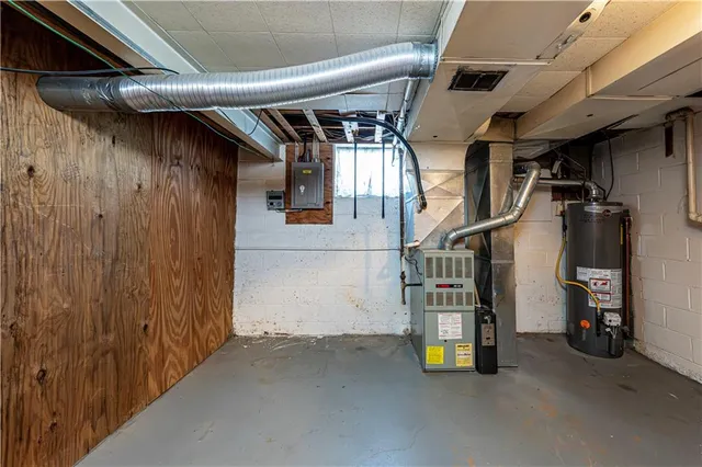 a kitchen with refrigerator and cabinets