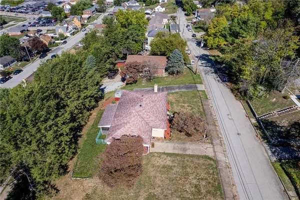 an aerial view of a house with outdoor space