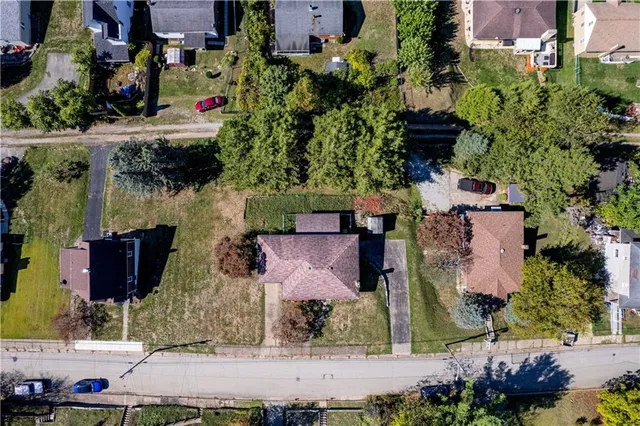 an aerial view of houses with yard