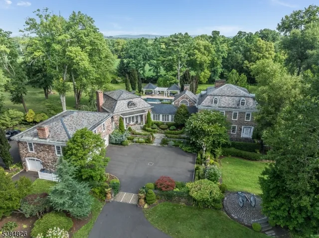 an aerial view of a house with a garden and plants