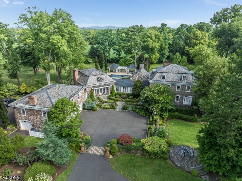 an aerial view of a house with a garden and plants