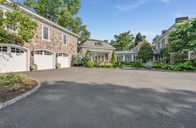 312 Hamden Road Annandale, NJ 08801 - Photo 18 of 50 a front view of a house with a yard and garage