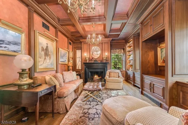 a living room with furniture a fireplace and a table