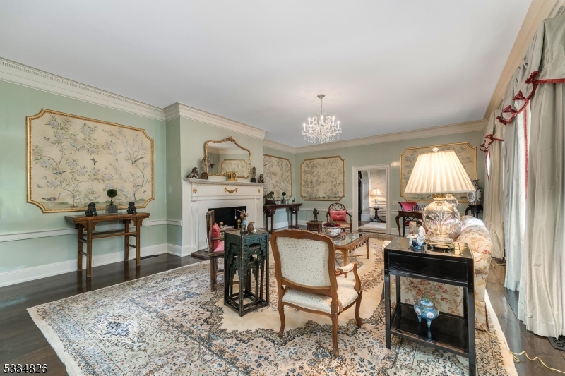 312 Hamden Road Annandale, NJ 08801 - Photo 36 of 50 a living room with furniture a fireplace and a table