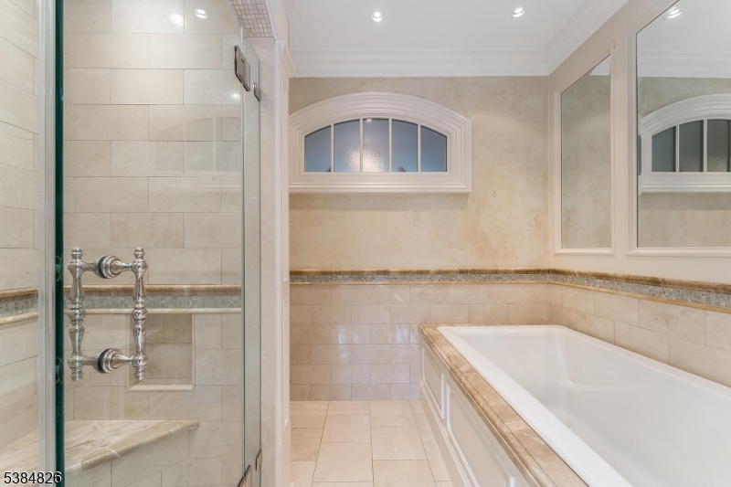 312 Hamden Road Annandale, NJ 08801 - Photo 40 of 50 a bathroom with a tub a sink and a window
