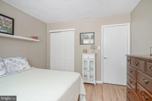 a bedroom with a bed and a closet