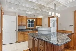 a kitchen with center island table and chairs