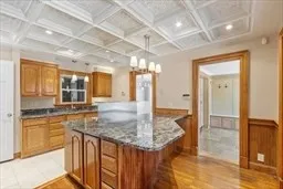 a kitchen with granite countertop a sink and cabinets