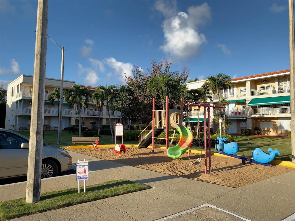 968 Camino Las Picüas, Unit 30 Rio Grande, Río Grande 00745 - Photo 24 of 24 a view of a park with swings and slides