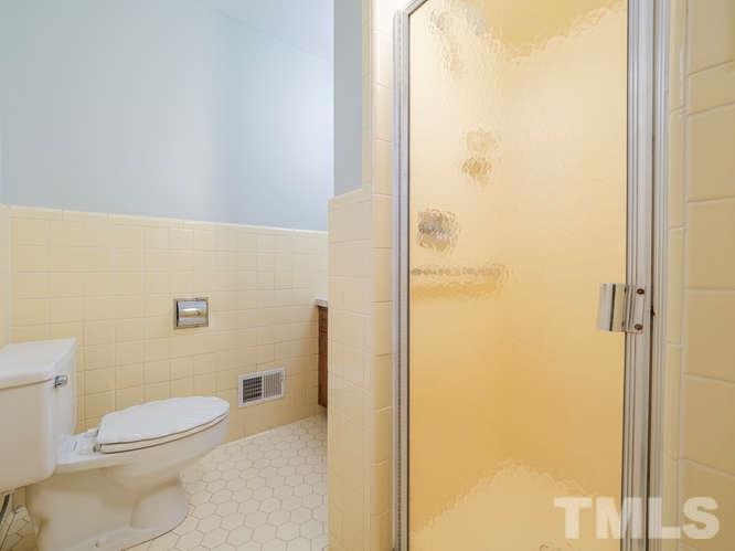 2205 Barfield Court Raleigh, NC 27612 - Photo 20 of 30 a bathroom with a toilet and a shower