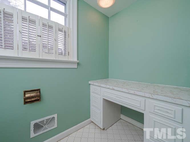 2205 Barfield Court Raleigh, NC 27612 - Photo 22 of 30 a room with a bed and a window