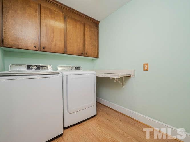 2205 Barfield Court Raleigh, NC 27612 - Photo 29 of 30 a utility room with dryer and washer