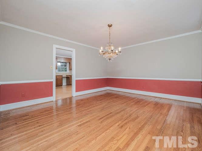 2205 Barfield Court Raleigh, NC 27612 - Photo 6 of 30 a view of empty room with wooden floor and fan