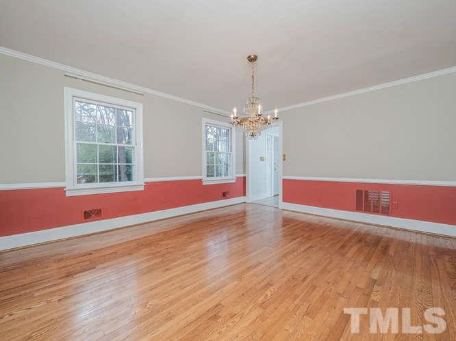 2205 Barfield Court Raleigh, NC 27612 - Photo 7 of 30 a view of empty room with wooden floor and fan