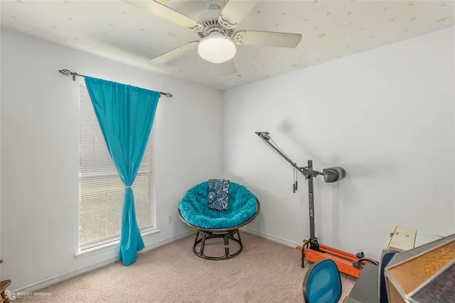 a view of a room with a table and a chandelier