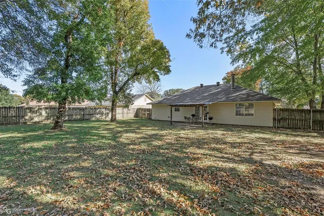 a house that has a tree in front of it