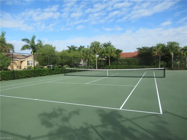 a view of an outdoor space and tennis court