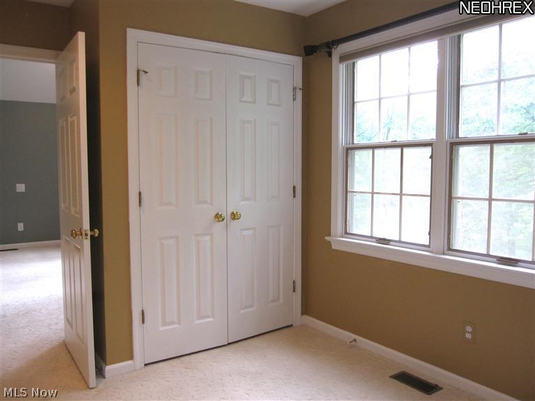 37850 Jackson Road Chagrin Falls, OH 44022 - Photo 13 of 22 Master bedroom dressing areas have views to the backyard.