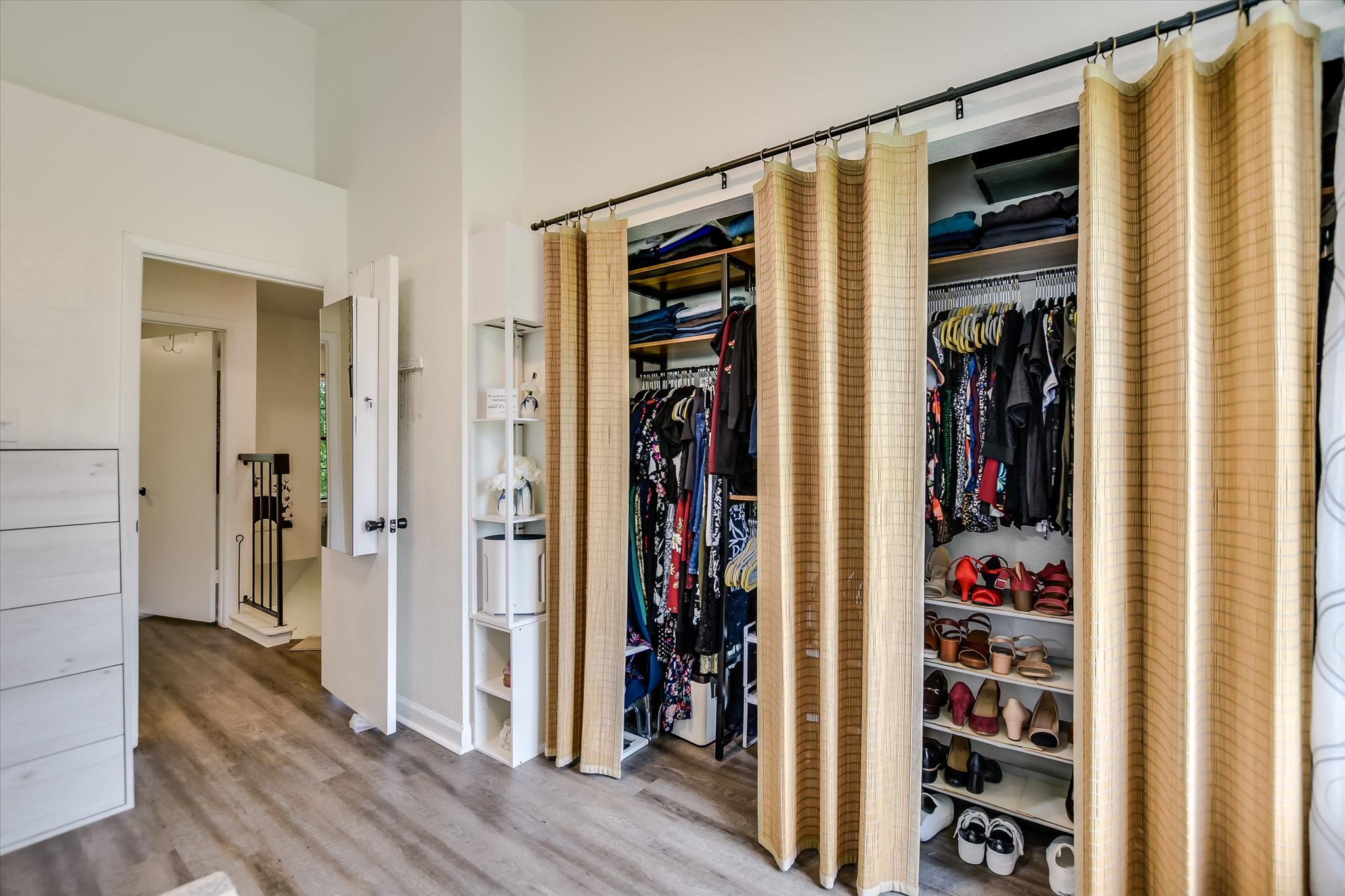 11901 Swearingen Drive, Unit 4 Austin, TX 78758 - Photo 10 of 23 a view of walk in closet with clothes and shoes