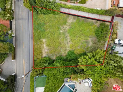 a view of a balcony with plants