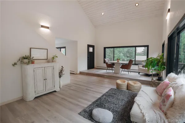 a living room with furniture and a large window