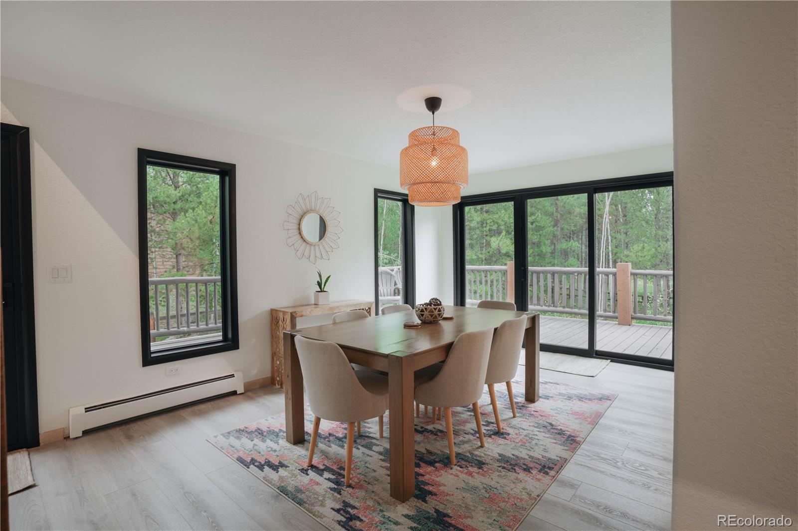 1709 Red Hawk Road Silverthorne, CO 80498 - Photo 21 of 50 a view of a dining room with furniture window and wooden floor