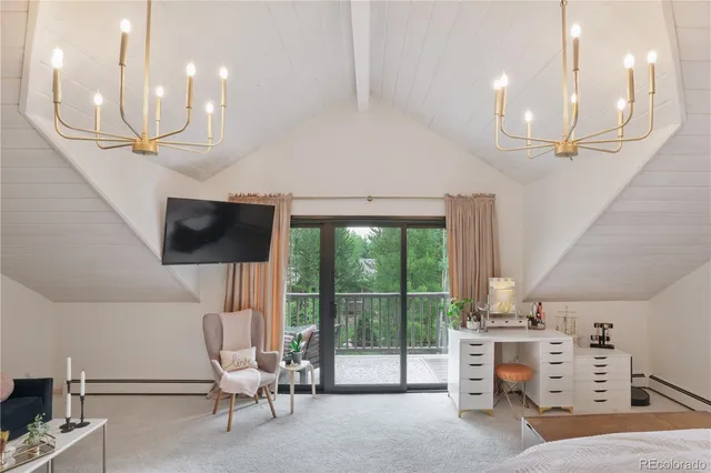 a view of a room with workspace and windows