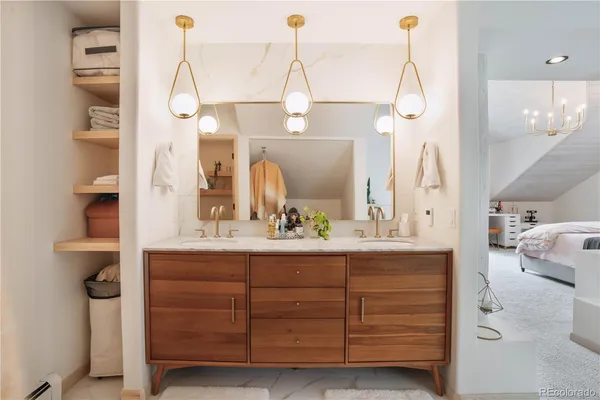 a bathroom with a double vanity sink a mirror and shower