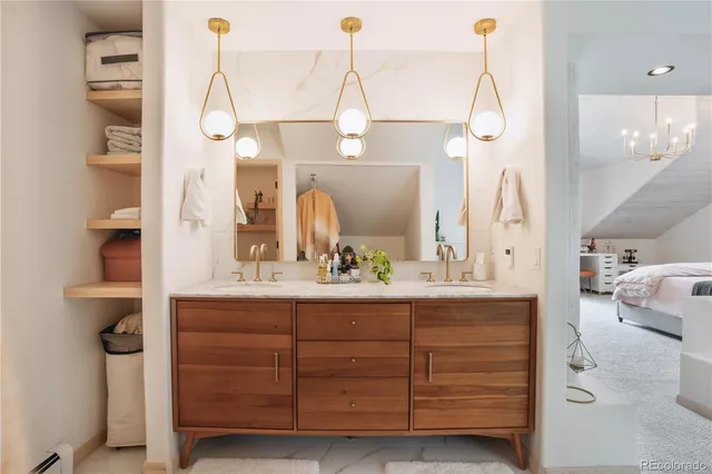 a bathroom with a double vanity sink a mirror and shower