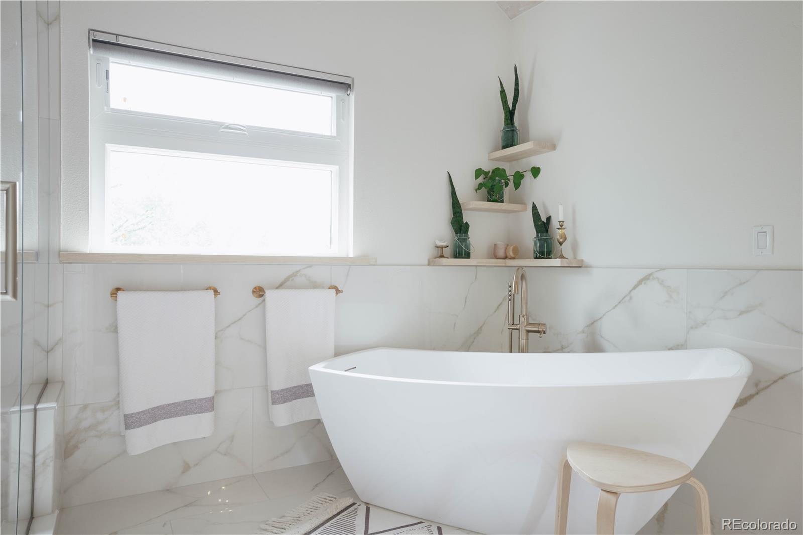 1709 Red Hawk Road Silverthorne, CO 80498 - Photo 29 of 50 a white bath tub sitting next to a window