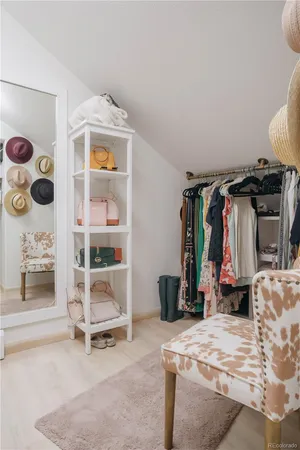 a bedroom with a bed and a mirror