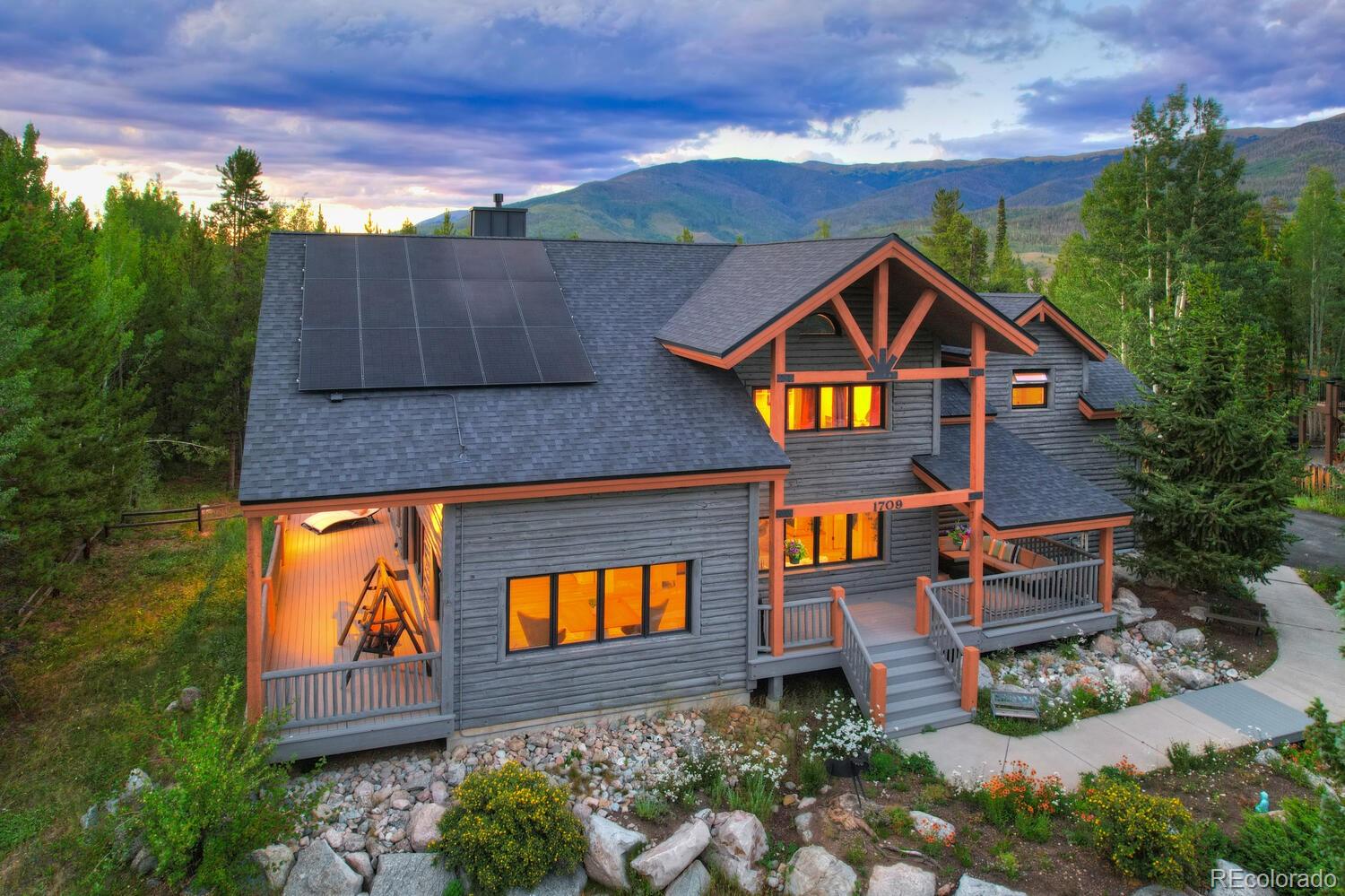 1709 Red Hawk Road Silverthorne, CO 80498 - Photo 3 of 50 an aerial view of a house with swimming pool and garden