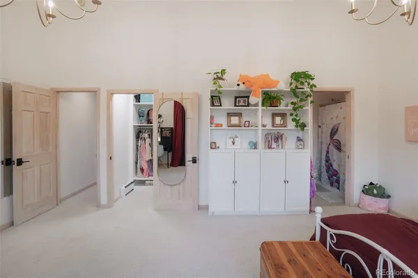a view of a livingroom with furniture and workspace