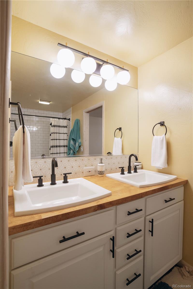 1709 Red Hawk Road Silverthorne, CO 80498 - Photo 37 of 50 a bathroom with a sink and a mirror